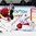 MINSK, BELARUS - MAY 11: Belarus's Vitali Koval #1 attempts to make the save on Switzerland's Kevin Fiala #13 while Dmitri Korobov #89 and Denis Hollenstein #70 look on during preliminary round action at the 2014 IIHF Ice Hockey World Championship. (Photo by Andre Ringuette/HHOF-IIHF Images)

